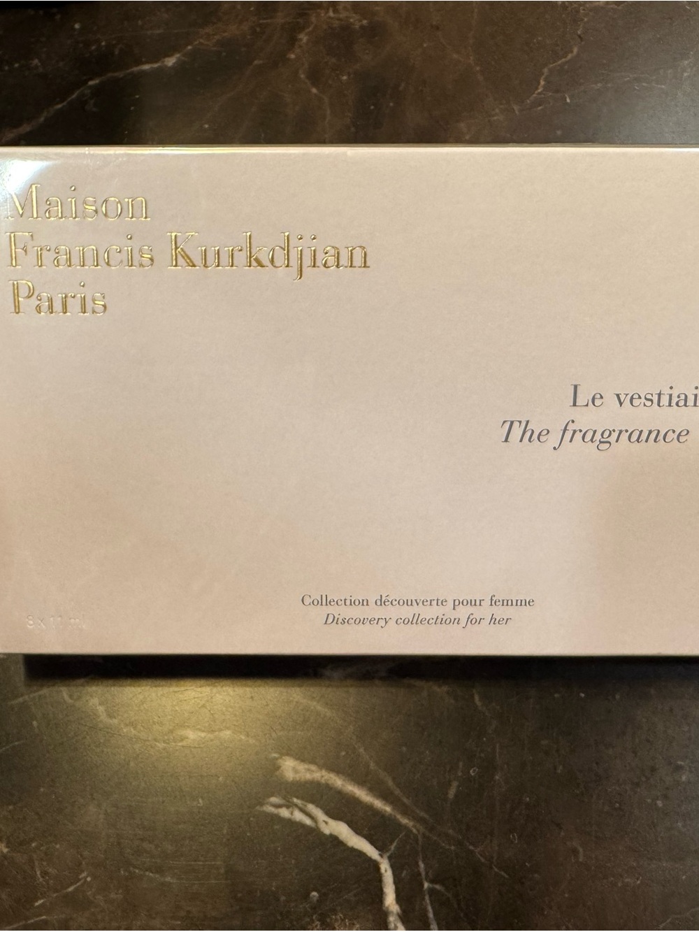 Maison Francis Kurkdjian pale pink and cream box with black text